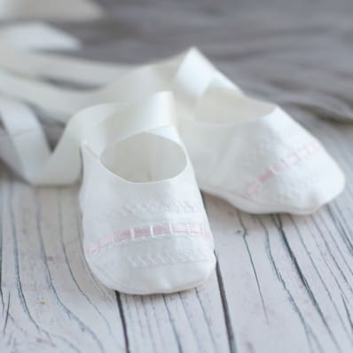 Christening booties with ribbon ties