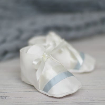 Jack silk Christening booties with blue trim