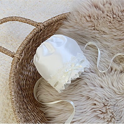 Silk Christening bonnet with cotton lace threaded with satin ribbon in ivory